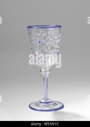 Wine glass Goblet with flower and leaf vines, Vaulted base with a ground star at the bottom. Faceted cut with a double white-blue spiral. Above that a hollow knot between two discs. Funnel shaped calyx, rounded on the underside, adorned with melted millefiori (flowers) in different colors of glass and with the wheel engraved vines, flowers, ornament, Baccarat, Paris, 1846 - c. 1860, glass, millefiori glass, grinding, h 20.3 cm × d 8.9 cm Stock Photo