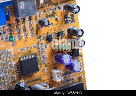 Detailed complicated computer circuitry, circuit board with electronic elements attached isolated on white background. Advanced technology, hardware Stock Photo