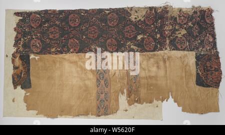 Fragment of a tunic, Fragment of a tunic with sewn-on decorations consisting of two tabulae, two clavi and two broad bands sewn together. The sewn-on parts have different decorations. Tabulae: dark blue ground with red two horsemen with nimbus and raised hand in a circle with leaf vines. Clavi: red soil with repeating motif of staggered flower branches in red, orange, blue, yellow and green on dark blue soil in oval. In between a pendulum line with white dots, an edge with white line motifs on one side. Wide tires: Dark blue ground with diamond-shaped pendulum motif with alternating a circle Stock Photo
