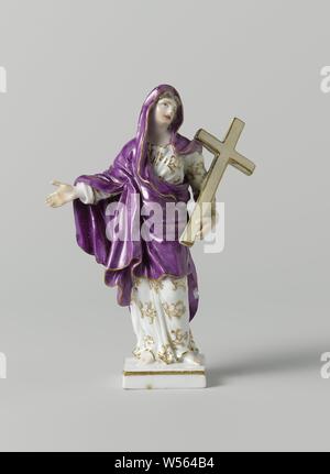Fides (Faith), Figure of painted porcelain. A woman (Fides) with a cross in her left hand stands on a square gold-edged pedestal. She is wearing a white dress painted with golden flowers and a purple cloak. The figure is marked, Faith, 'Fides', 'Fede', 'Fede catholica', 'Fede christiana', 'Fede christiana catholica' (Ripa), one of the Three Theological Virtues, Meissener Porzellan Manufaktur, Meissen, c. 1779 - c. 1800, porcelain (material), h 12.4 cm × w 9 cm × d 3.8 cm Stock Photo