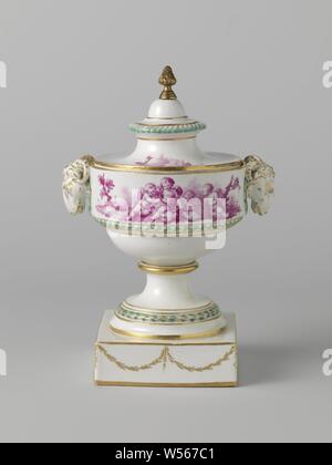 Vase, painted with putti, Vase with ram's heads and porcelain lid, painted in beet red with four putti on the body on one side in a landscape near a bird cage with two birds in front the other side four putti in a landscape with a sheep (?), on the lid two grounds with, among other things, musical instruments and a basket with roses. Around the round base a leaf wreath, under the putti scenes a band with braid, around the ram heads a laurel wreath and along the lid knob godrons, all in relief and decorated in green and gold. Gold leaf garlands on the square plinth. Gold rushes along Stock Photo