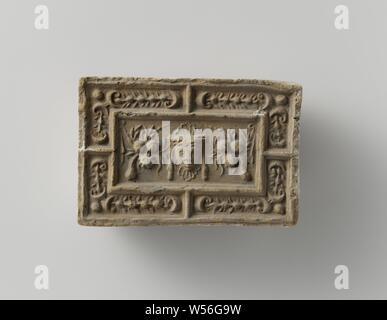 Fire brick depicting a mascaron between two fruit festivals, the whole surrounded by a fruit festival., anonymous, Antwerp (possibly), c. 1575 - c. 1600, earthenware, h 10 cm × w 14.5 cm × t 5.5 cm Stock Photo