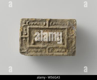 Fire brick depicting a mascaron between two fruit festivals, the whole surrounded by a fruit festival., anonymous, Antwerp (possibly), c. 1575 - c. 1600, earthenware, h 10 cm × w 14.5 cm × t 5.5 cm Stock Photo