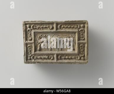 Fire brick depicting a mascaron between two fruit festivals, the whole surrounded by a fruit festival., anonymous, Antwerp (possibly), c. 1575 - c. 1600, earthenware, h 10 cm × w 14.5 cm × t 5.5 cm Stock Photo