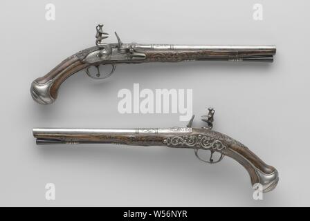 Pair of flintlock pistols, Flintlock pistol, Part of a couple. The rooster and the fire steel of the castle are embossed with leaves, the lock plate is engraved with lofwerk, a cupid with a bow and arrow, Cybele in a cart drawn by a lion with four wheels and the signature. The barrel is provided with two pairs of rings as a partition between the different parts of the barrel, the barrel is chiseled on the back with foliage around the rear visor chiseled as a grotesque mask, stamped on the bottom with the arms of Utrecht under an illegible mark, perhaps a rosette. The burr walnut stock is Stock Photo