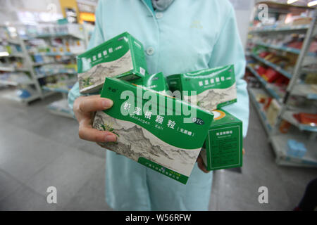 --FILE--Boxes of isatis indigotica root or 'banlangen,' a traditional Chinese medicinal herb used for the prevention and treatment of colds, are for s Stock Photo