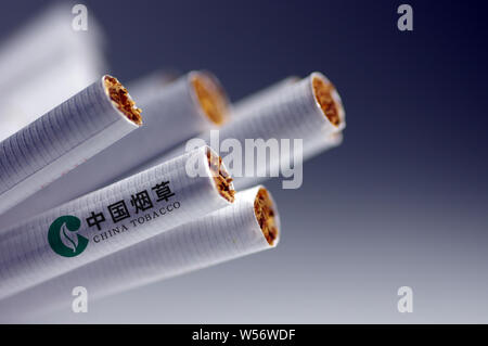 tobacco abbreviation --FILE--A logo of China National Tobacco Corporation (commonly known as  China Tobacco, abbreviated as CNTC) is seen on a cigarette in Ji'nan city,  eas Stock Photo