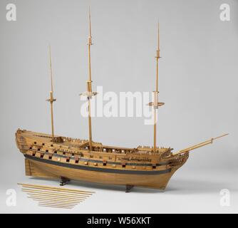 Model of a 74-Gun Ship of the Line, Detailed detailed construction model of the hull in two stacked halves, with loose round timber. Seventy-four gun ports spread over three decks, five decks in total, with full bombardment and many equipment, some parts numbered. On the elaborate galleon a crowned lion as figurehead, four conveniences, a sea horse and fish between the slobles. Twisted mirror and hollow wulf with two gates, fence and side gallery of two floors, entirely decorated with carvings of allegorical figures, praises and weapon trophies. Straight rudder equipped with suckers, Stock Photo