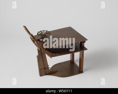 Model of Steering Gear, Technical model with a rough representation of a stern with wrinkled mirror and hollow wulf and two decks. Straight rudder with a toothed quadrant mounted on the square rudder head. The steering wheel is mounted horizontally, a small gear on the shaft engages in the rudder quadrant., anonymous, Netherlands (possibly), 1820 - 1858, wood (plant material), brass (alloy), model: h 40.5 cm × w 39.2 cm × d 25.4 cm packaging capsule: h 44 cm × w 83 cm × d 33.5 cm Stock Photo