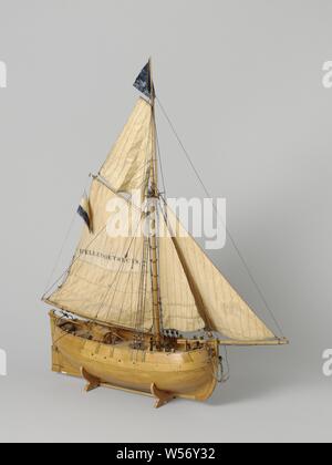 Model of a Pilot Vessel, Tested block model of a one-master. Round bow and stern, falling stern, straight rudder with decorated rudder head and wooden tiller going over a kind of slider on the buoy. The sheer runs slightly to both ends, a bar wood. Peaked trusses. The model is equipped with two anchors, a roasting spindle, two water barrels, a chimney for the galley, a deck light, a roef, two pumps, two oars, two boat hooks, an entrance. The rig is a fork rig with sails, the bowsprit on port side, breeding with overflow on deck, a fork top sail, a blue flag and a tricolor, inscription Stock Photo