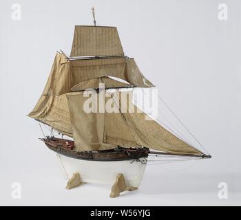 Model of an 18-Gun Cutter, witnessed and polychromed model of an over-built cutter. Thirteen of the eighteen pieces have been preserved. The ship has a slightly curved prow and sharp bow foundation, small flat mirror, large hollow wulf painted with draperies, and a small fence with inscription in winged cartouche, and davits. Falling stern with straight rudder with square rudder king in trousers, wooden tiller in steering wheel bars on deck. The model has an upper and lower deck. On the upper deck a roof, entrance and three hatches. The model is also equipped with a loose galley on the front Stock Photo