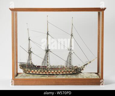 Glass Model of a 76-Gun Ship of the Line, Full model of a line ship, three-mast, with 76 pieces up to the waterline The three masts and the bowsprit consist of thick twisted glass wire. The ship is further made up of single and, if necessary, several thin glass wires next to each other. The wires are black or colorless and almost all twisted. On board nine figures in different colored clothes, and a dog. The figurehead is a male figure with a stab weapon in the right hand. A sloop on both sides of the ship. The model is in a wooden case. The sea is represented with glass chips., anonymous Stock Photo