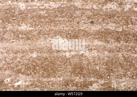 New brown travertine background as part of your attractive natural interior. Texture in high resolution, 50 megapixels. Stock Photo