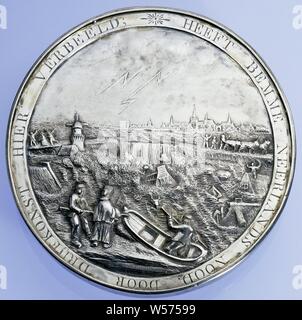 The February Flood of 1825, Flood in the Netherlands, Silver Medal. Obverse: image of floods within the circumscription. Reverse: memorial consisting of column on base with inscriptions, on top of the column three boats, above which an angel, lit by heavenly light, holds a wreath, in the background people walk, escapes ship that perishes and group of people on the coast within a circumference., G.F. Sartorius jr., Rotterdam, 1825, silver (metal), engraving, d 9.9 cm × w 117.68 cm Stock Photo