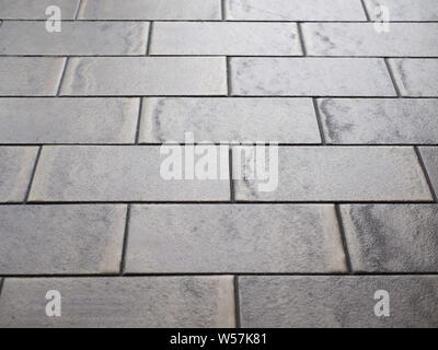 tiled terrazzo floor with brown ceramic tiles useful as a background Stock Photo