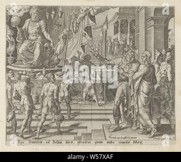 King Cyrus shows Daniel the statue of the god Bel Van den Bel and den Draeck in Babel (series title) History of Daniel, Bel and the dragon (series title) Den Grooten Figuer-Bibel (...) (series title), King Cyrus shows Daniel the temple of the god Bel. In the center of the temple is a large statue of the seated deity. Around it are vases with incense. Servants are busy displaying food and drinks on a table in front of the statue. Under the representation an explanatory text in Latin. Print is part of an album, King Cyrus sets food before the image of Bel, Daniel and his servants strew ashes Stock Photo