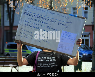 26 July 2019, Germany (German), Magdeburg: Pupils, students and residents of Magdeburg demonstrate with protest posters for more climate protection. The Magdeburg Fridays for Future movement had called for the first Climate Moon during the summer holidays. Photo: Peter Förster/dpa-Zentralbild/dpa Stock Photo