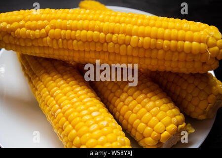 Grains of ripe corn. macro. Corn on the cob, the food is ripe, juicy, delicious corn. Photo of corn background. Fresh young sweet corn on cobs, closeu Stock Photo