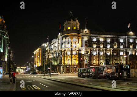 Belgrade / Serbia - October 14 2013: A street and passenger bus in Belgrade at night Stock Photo