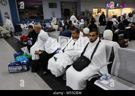July 26, 2019, Rafah, Sinai, Egypt: The journey of Palestinian pilgrims to attend the annual pilgrimage to Mecca (Hajj) from the Rafah crossing border to Jeddah airport through Egypt's Cairo airport, July 25, 2019. The Hajj (pilgrimage) is an annual Islamic pilgrimage to Mecca, Saudi Arabia, the holiest city for Muslims, and a mandatory religious duty for Muslims that must be carried out at least once in their lifetime Credit: Ashraf Amra/APA Images/ZUMA Wire/Alamy Live News Stock Photo