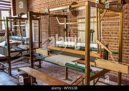 Traditional silk fabric loom. Old method manual fabric weaving machine. No people Stock Photo