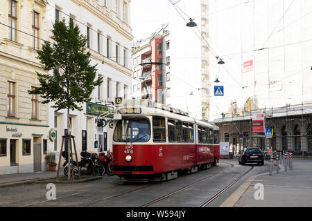 An old-style D tram travels down Porzellangasse toward Nussdorf in the Alsergrund neighborhood of Vienna, Austria. Stock Photo
