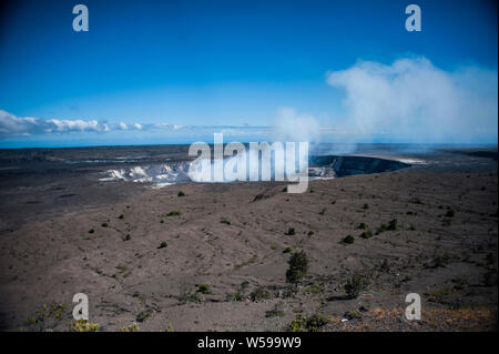 Steam rises from the mouth of the goddess of volcanoes known as Pele at the Hawaii Volcanoes National Park on the The Big Island of Hawaii Stock Photo