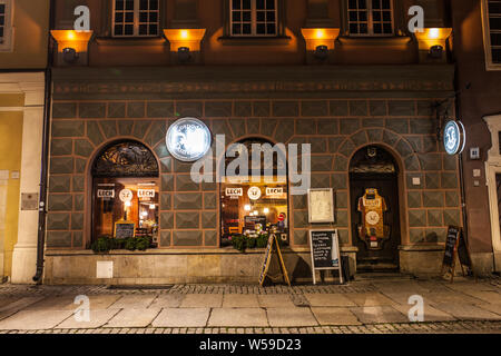 Poznan, Poland, Nov 2017: old Market Square at night, restaurant, bar, PUB, polish cuisine Stock Photo