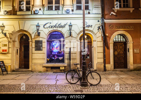 Poznan, Poland, Nov 2017: old Market Square at night, restaurant, bar, PUB, polish cuisine Stock Photo