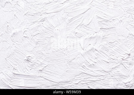 Abstract white grunge painted background. Background was painted with titinium white oil color on canvas by hand. Stock Photo
