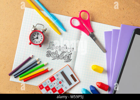 Back to school concept. School supplies on an open notebook Stock Photo