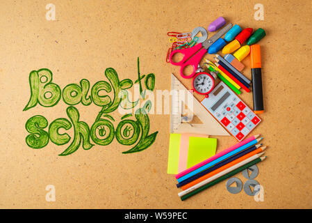 Back to school concept. School supplies on wooden board. Stock Photo