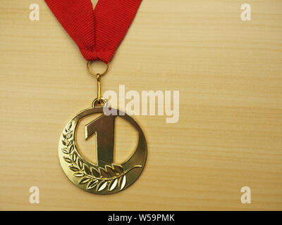 Gold first place winners medal. Success achievement concept. Stock Photo