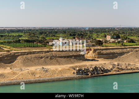 Suez, Egypt - November 5, 2017: Typical Suez canal landscape, farm land along the canal in Egypt, Africa.