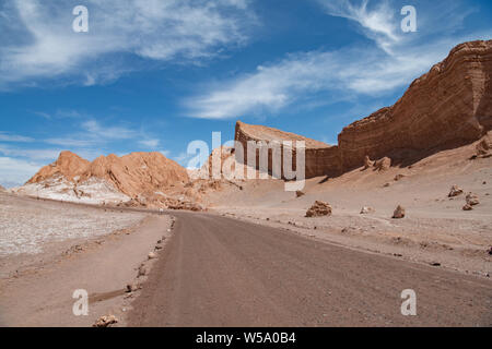 sandy road leading to escarpment in Atacama Desert, Chile Stock Photo