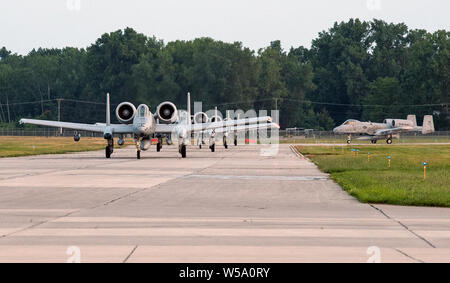 Six pilots of the 107th Fighter Squadron here, taxi their A-10 Thunderbolts down the flight line after returning from a combat deployment on July 26, 2019. More than 200 Airmen Selfridge Air National Guard Base returned from Afghanistan this week after serving up to six months in the U.S. Central Command area of responsibility. “Being ready for the mission downrange is what we constantly train for,” said Brig. Gen. Rolf Mammen, 127th Wing and Selfridge Air National Guard Base commander. We are an operational reserve, and this successful deployment is a testament to our combat capability.' Stock Photo