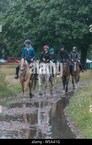 Wimbledon London UK. 27th  July 2019. Horse riders  on Wimbledon Common  on a rainy morning as temperatures beging to cool down  following the record heatwave set on Thursday .Credit: amer ghazzal/Alamy Live News Stock Photo