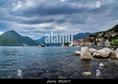 Montenegro, Historic ancient beautiful coastal town perast surrounded by high mountains nature landscape in kotor bay fjord Stock Photo