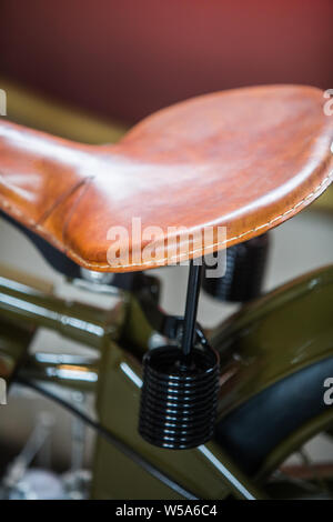 Close up shot of a vintage leather motorcycle seat. Stock Photo