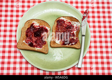 Wholemeal toast and raspberry jam Stock Photo