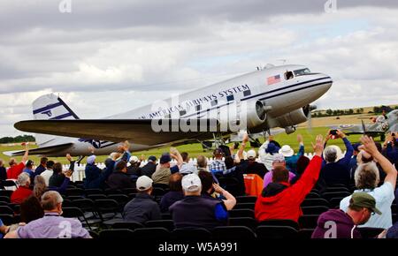 Pan Am Douglas C-47B (N877MG) taxiing past spectators at the Flying Legends airshow at the IWM Duxford on the 14th July 2019 Stock Photo