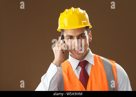 Male architect talking on mobile phone Stock Photo