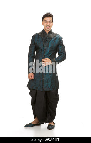 Indian groom standing and smiling Stock Photo