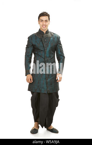 Indian groom standing and smiling Stock Photo