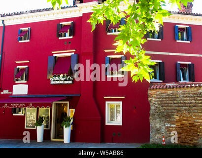 BURANO (VENICE), ITALY - SEPTEMBER 19. 2018 - View on facade of famous fancy painted colorful houses Stock Photo