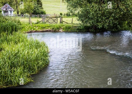 The River Windrush in summer in the Cotswolds. Stock Photo