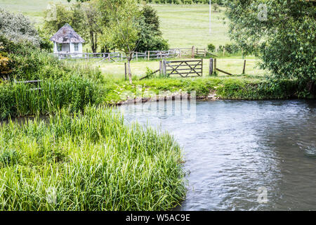 The River Windrush in summer in the Cotswolds. Stock Photo