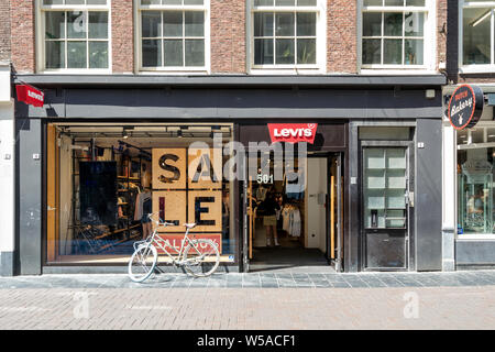 Levi's store in Amsterdam, The Netherlands. Levi's is brand of denim jeans, owned by Levi Strauss & Co., an American clothing company. Stock Photo