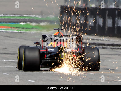 Hockenheim, Germany. 27th July, 2019. Motorsport: Formula 1 World Championship, Grand Prix of Germany. From the racing car of Max Verstappen from the Netherlands of the team Aston Martin Red Bull Racing sparks strike at the third free practice. Credit: Uli Deck/dpa/Alamy Live News Stock Photo