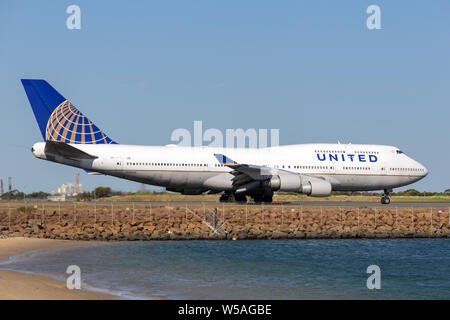 United Airlines Boeing 747 jumbo jet airliner on the runway at Sydney Airport. Stock Photo